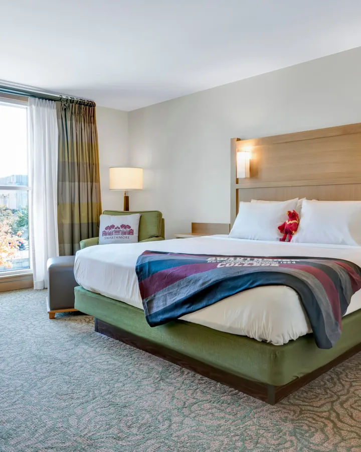 Guest room with a Swarthmore College blanket on the bed
