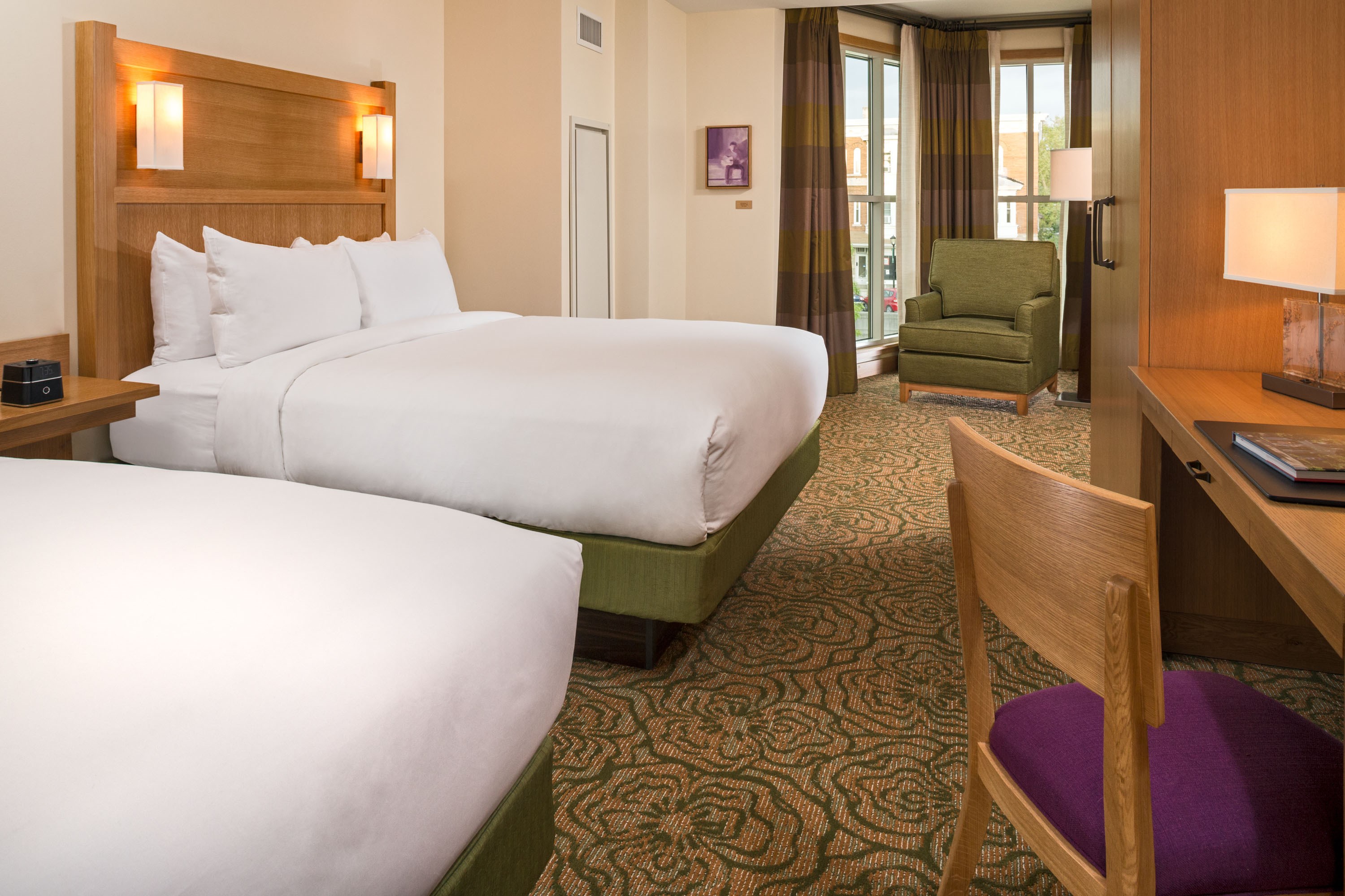 Double queen guest room with a sitting area at The Inn at Swarthmore